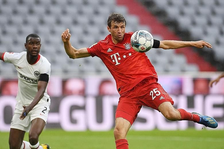 Bayern's Thomas Muller controlling the ball during the 5-2 win over Frankfurt on Saturday that restored their four-point lead.