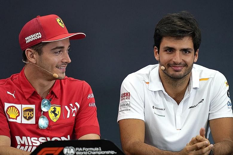 Ferrari driver Charles Leclerc (left) and McLaren's Carlos Sainz during a press conference at last year's Japanese Grand Prix in Suzuka. Sainz will be Leclerc's new teammate in place of Sebastian Vettel next season.