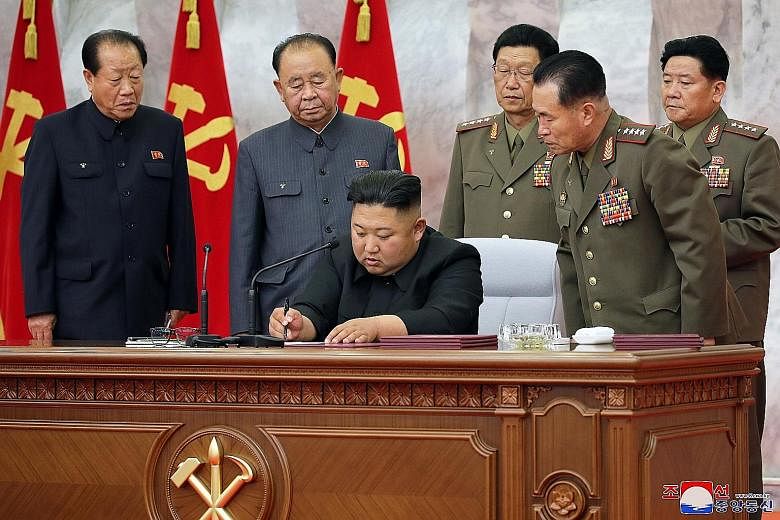 A photo from the official North Korean Central News Agency yesterday showing Mr Kim Jong Un during a meeting of military leaders in Pyongyang. The date of the meeting was not given. PHOTO: EPA-EFE