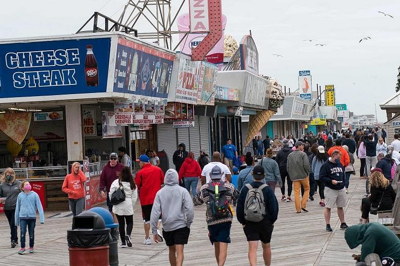 Crowds packing the boardwalk in Seaside Heights, New Jersey, on Sunday during the Memorial Day holiday weekend. Some beaches were packed in Florida and other gulf states, forcing the authorities to break up large gatherings.