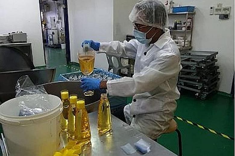 Mr Gordon Li, a customer service associate of logistics company UBTS, has been redeployed to baking goods retailer Phoon Huat's packaging factory. PHOTO: UBTS