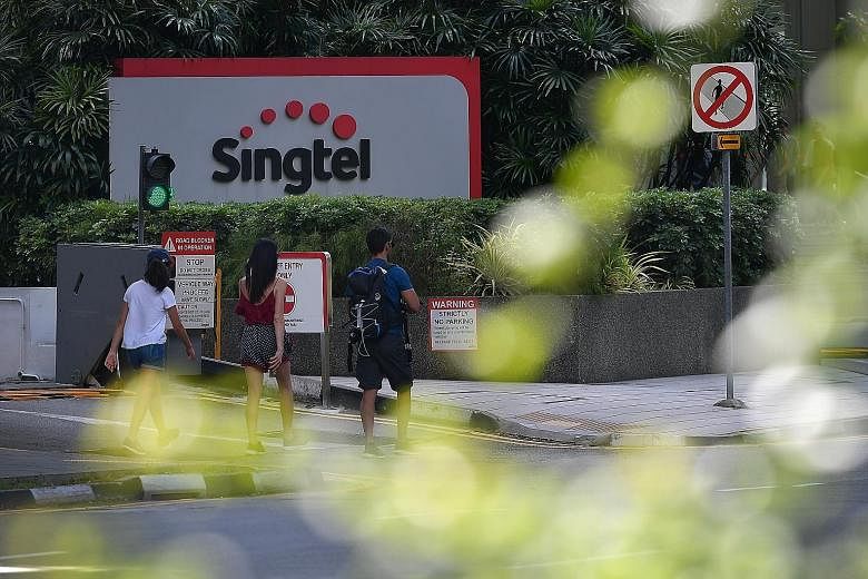 Singtel took a net exceptional charge of $302 million for the fourth quarter, mainly arising from India unit Bharti Airtel's provision for a one-time spectrum charge. ST FILE PHOTO