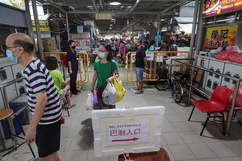 Jurong Point's FairPrice outlet (above) and Jurong West Market and Food Centre (left) at Block 505 Jurong West Street 52 are two spots which were recently visited by people who had tested positive for the coronavirus.