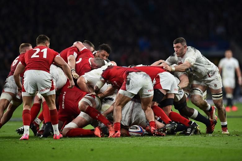 The English and Welsh teams leaving very little distance between them in a scrum during the Six Nations in March.