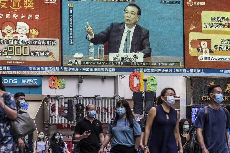 Chinese premier Li Keqiang, seen speaking on an outdoor video screen in Hong Kong on Thursday. The emergence of China's national security Bill and the United States response that it can no longer certify Hong Kong's political autonomy is stoking conc