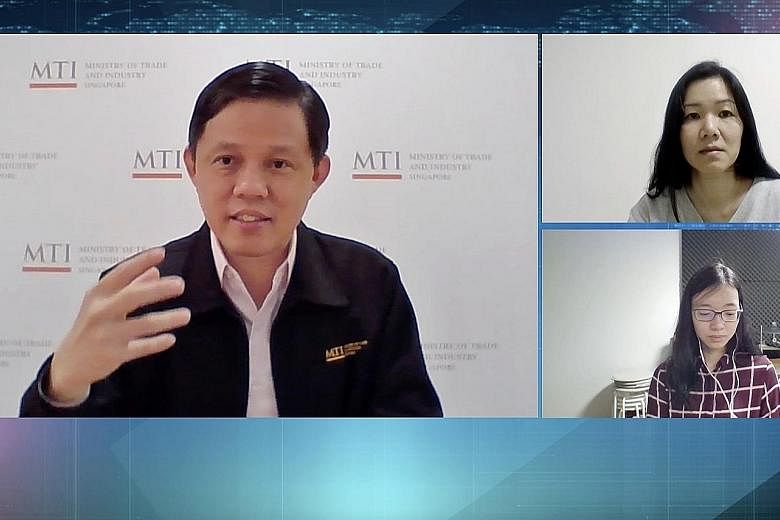 Trade and Industry Minister Chan Chun Sing speaking to The Straits Times' senior political correspondent Tham Yuen-C (top right) and manpower correspondent Joanna Seow in a video interview on Wednesday. PHOTO: SPH