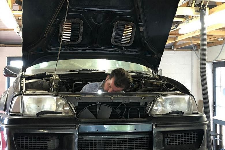 London-based Paul Mitchell came to Singapore to acquire the Lotus Carlton in February last year. He converted his garage at home into a workshop, so that he could work on restoring the car (above). 