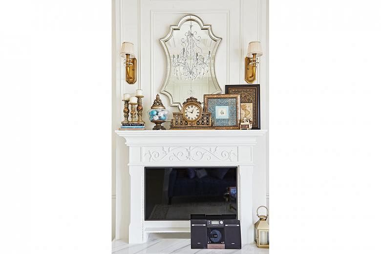 The fireplace and mantelpiece are elevated to create a hearth effect and frame the television set. 