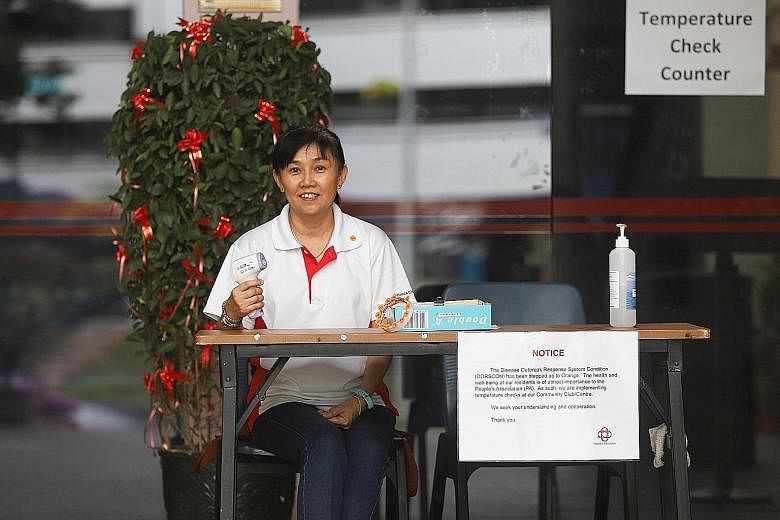 New citizen Lan Eoi Nah helped to screen temperatures of visitors to Chua Chu Kang Community Club in February, before the start of the circuit breaker. She also roped in her adult children to volunteer at grassroots events. 