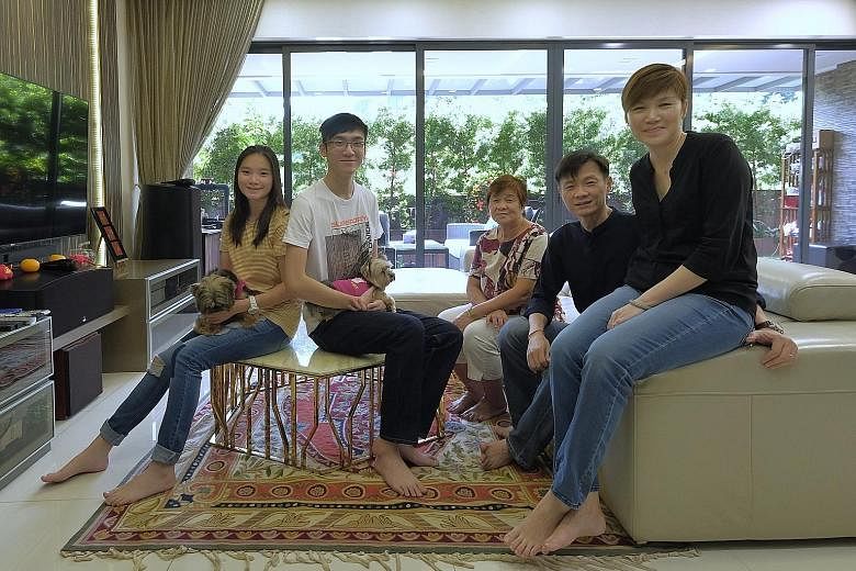 OneConnect’s South-east Asia CEO Tan Bin Ru, 46, with her husband Low Chong Eng, 46, children Adelle, 18, and Bryan, 20, and mother-in-law Teo Ha, 73, in their home at The Interlace in Depot Road. Her unit is on the ground floor, with four bedrooms, a gen