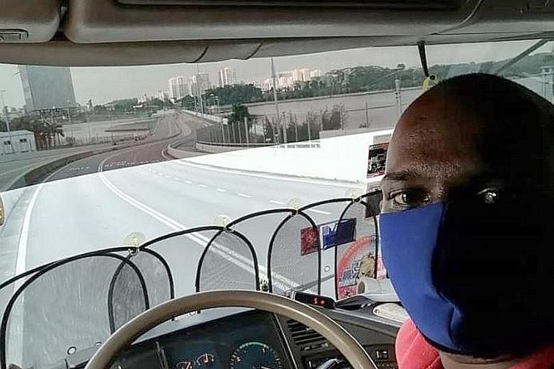 Travel curbs in both Singapore and Malaysia have seen traffic at the Woodlands and Tuas checkpoints empty out. These days, Malaysian lorry driver Muhammad Rizwan Muhammad is able to make faster journeys from Johor Baru to Singapore and back. PHOTO: C