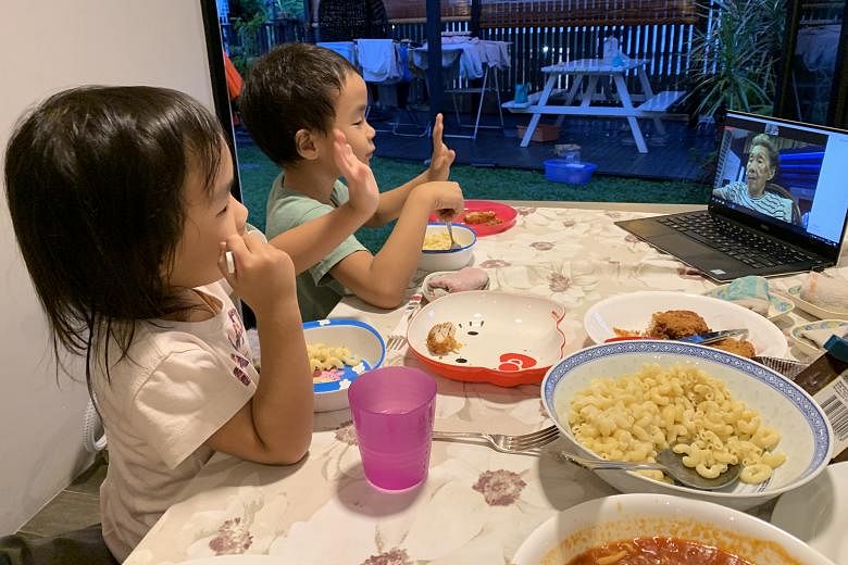 Communications director Leanne Sim’s children – Emmanuelle, four, and Elliott, seven – speaking to their greatgrandmother Elvie May Chiew, 93, via Zoom. 