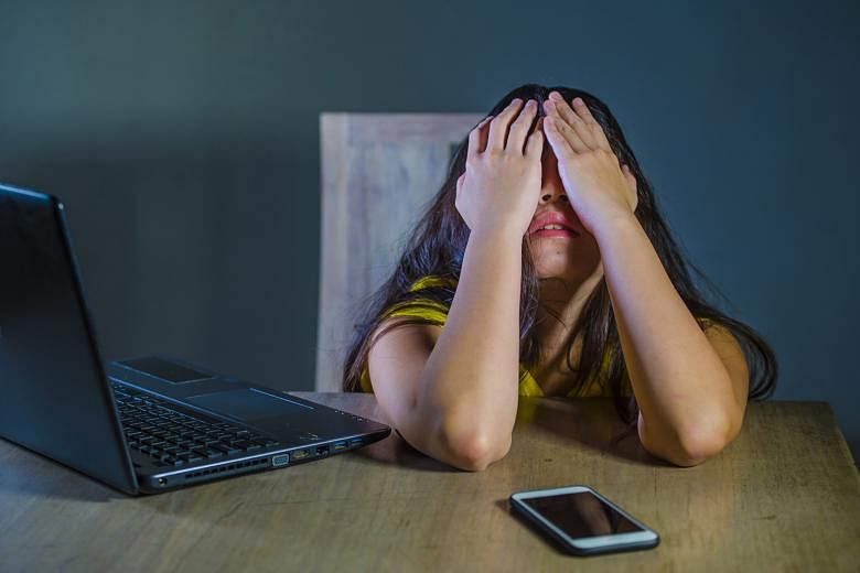 Signs that your child may be a victim of cyber bullying include the child getting upset after spending time online or shutting off his or her device abruptly. 