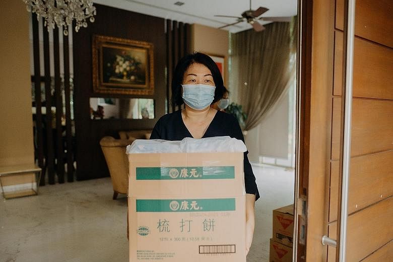 Volunteer Annie Gan helped to pack items for migrant workers who have been tested for the coronavirus and have been given the all-clear before they moved into temporary accommodation in Kismis Avenue.