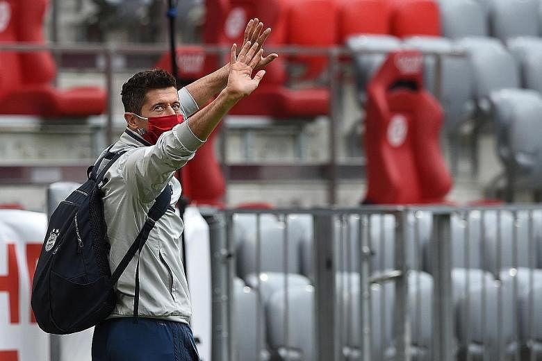 Bayern striker Robert Lewandowski waving to fans before the game against Dusseldorf. His double meant the Bundesliga's top scorer has now netted against every current German top-flight club. 