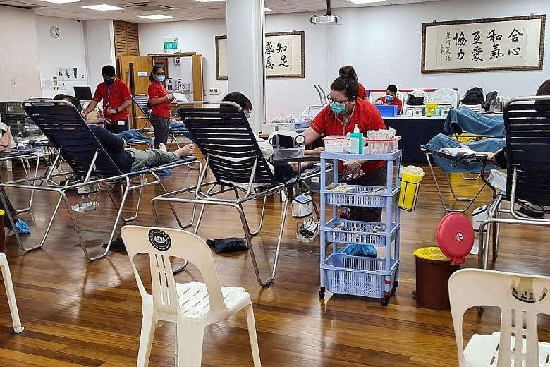 Donors at a community blood drive at the Tzu Chi Foundation last month. Currently, only four mobile drives are held each week compared with at least 10 such drives weekly in the past. PHOTO: SINGAPORE RED CROSS