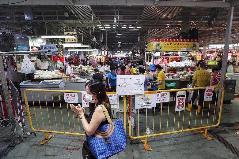Odd-or even-date entry restrictions at four popular markets, including the one at Block 505 Jurong West Street 52 (left), will continue, although NEA said the crowd situation at these markets has eased significantly over the last five weeks.