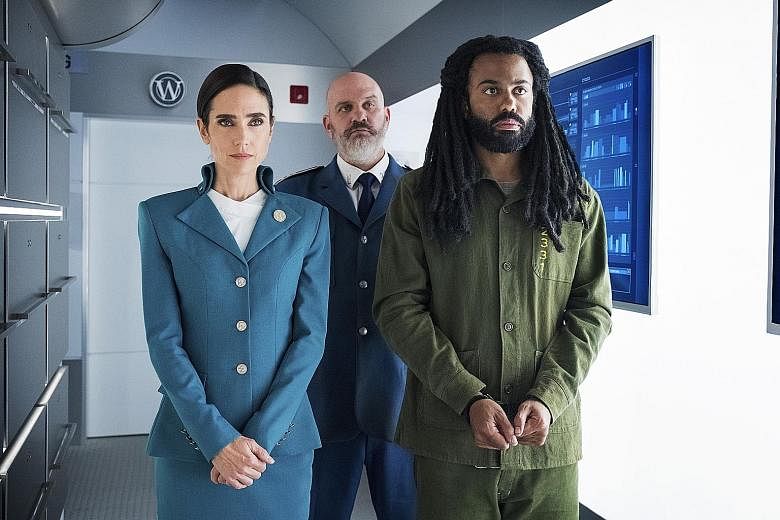 Actors Jennifer Connelly (left) and Daveed Diggs (in green) are the leads of Netflix series Snowpiercer.