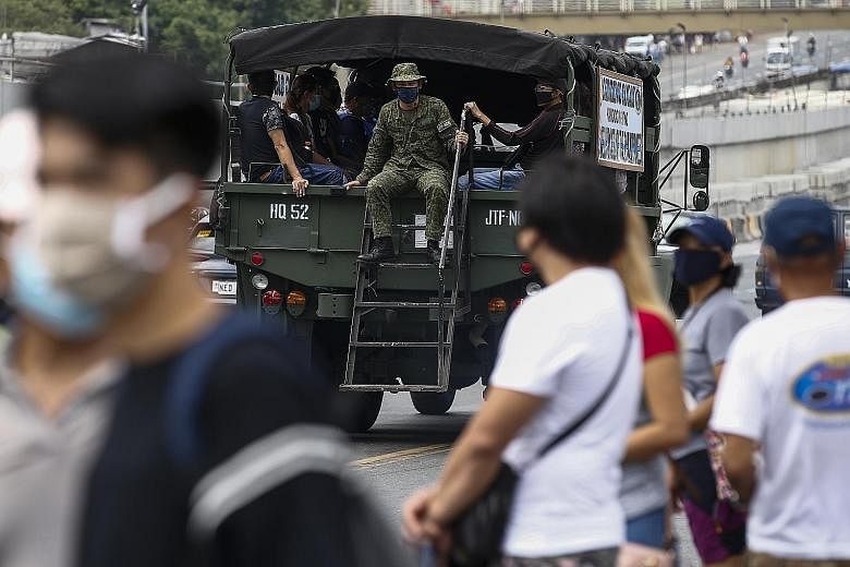 One of at least eight Philippine Army trucks deployed to ferry thousands of stranded commuters, many of whom were unaware they were waiting at non-designated bus stops.
