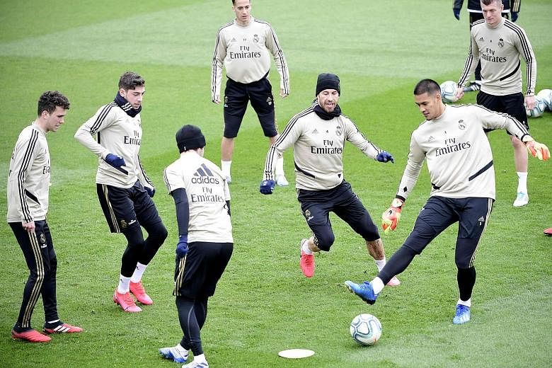 Real Madrid players, led by captain Sergio Ramos (third from right) training at their Estadio Alfredo di Stefano training centre, where they will play their six remaining home league games while the Santiago Bernabeu is being renovated. They are two 