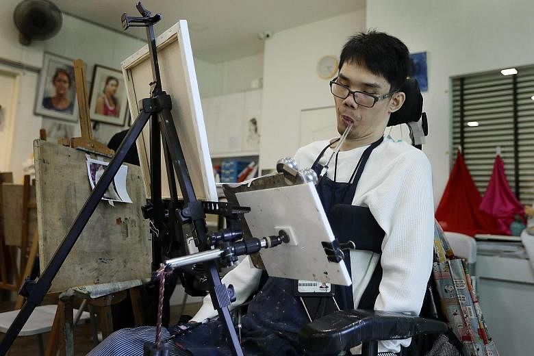 Mr Victor Hoon, who was severely injured in an accident in 2005, mouth painting at the Visual Arts Centre in Dhoby Ghaut in March.