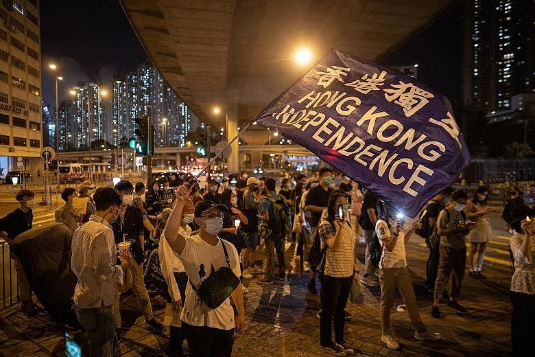 Pro-democracy activists taking part in a rally on the eve of the anniversary of the 1989 Tiananmen Square crackdown, in Hong Kong, yesterday. PHOTO: EPA-EFE