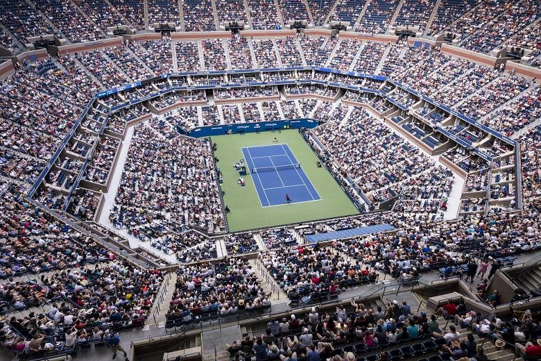 More than 850,000 fans turned up for the US Open last year at Flushing Meadows, whose main arena is the 24,000-capacity Arthur Ashe Stadium (left). This year's Grand Slam is set to be staged behind closed doors.
