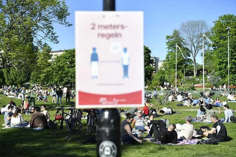 People enjoying the sunshine in Tantolunden park in Stockholm last Saturday. Sweden is facing mounting criticism for not doing more to combat the coronavirus, relying largely on voluntary action, social distancing and common-sense hygiene advice, res