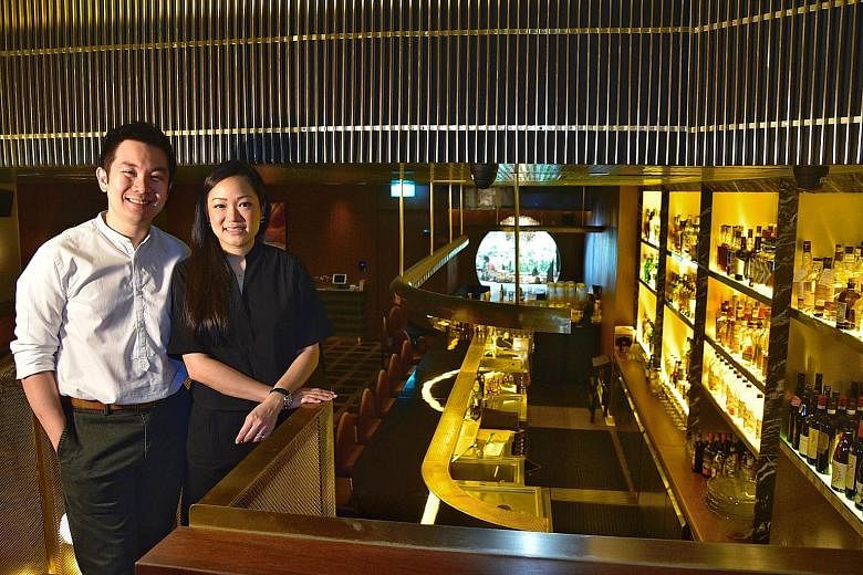 Mr Indra Kantono and his wife Gan Guoyi, founders of Jigger & Pony, at the bar's location at Amara Singapore hotel. Mr Kantono says a combination of rental waivers and the Jobs Support Scheme enabled him to retain all local staff without cutting thei