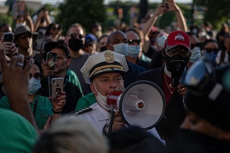 Above: Mr George Floyd's six-year-old daughter Gianna Floyd and her mother Roxie Washington. Mr Floyd died after a white policeman pinned his knee on his neck for nearly nine minutes on May 25. PHOTO: NYTIMES Left: Demonstrators protesting against th