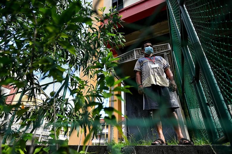 A migrant worker at the former site of Bedok North Secondary School in Jalan Damai yesterday. The site is among those being used to house healthy workers in a bid to curb Covid-19 transmission in dormitories. ST PHOTO: LIM YAOHUI
