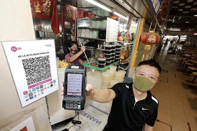 When Mr Goy Thuan Heng introduced cashless payments at his soya bean stall in West Coast Hawker Centre five years ago, few customers used the cashless system. But he now makes around 10 cashless transactions daily with a peak of more than 20 during w