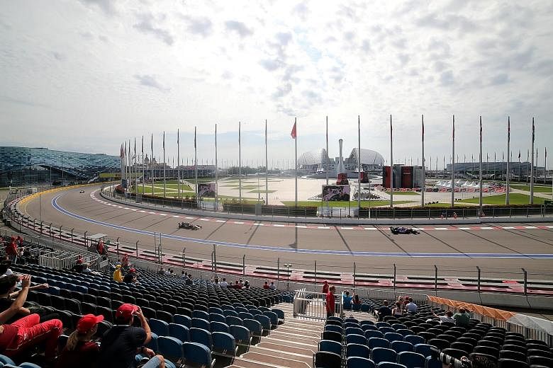 Fans watching a practice session ahead of the Russian Grand Prix last year. The Sochi circuit is near an airport and living quarters that was once part of the Olympic Village.