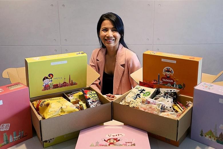 Ms Rachel Tan's sideline company SendThinks delivers a box of snacks from different countries to customers' doorsteps. She says SendThinks' business model centres on people's desire to send care packages to their loved ones and to quench the wanderlu