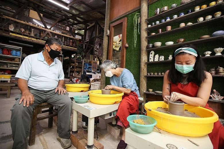 Thow Kwang Industry's Mr Tan Teck Yoke, his wife Yulianti Tan and niece Stella Tan. The family-owned pottery business conducts programmes at kindergartens, primary and secondary schools, as well as tours of its famous dragon kiln - one of only two le