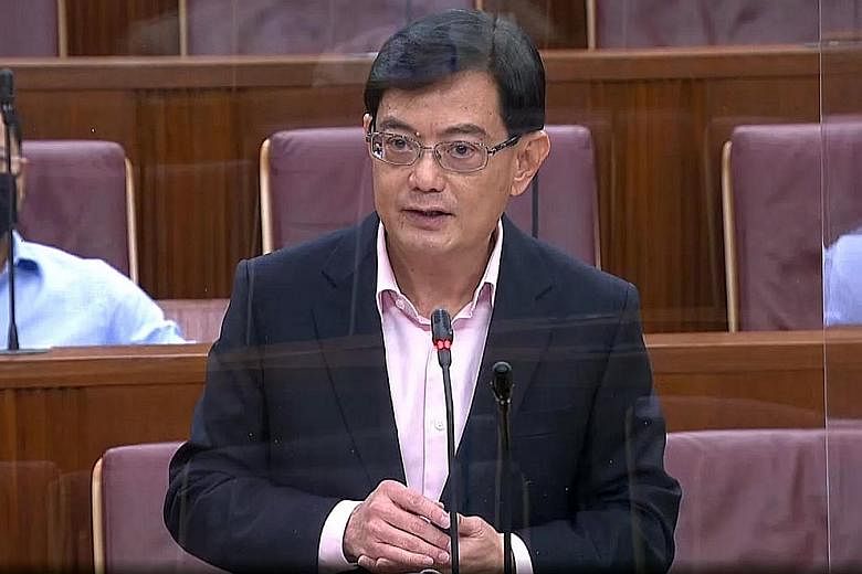 Deputy Prime Minister Heng Swee Keat speaking in Parliament yesterday. He said Singapore is not only armed with sizeable financial reserves that will help save many jobs, but it also has deep social reserves, mutual trust and close partnerships.