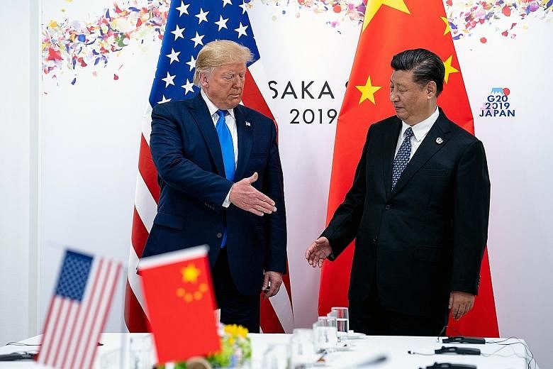 US President Donald Trump and China's leader Xi Jinping at a bilateral meeting at the Group of 20 summit in Japan last year. Shanghai-based former diplomat Kenneth Jarrett reckons that four more years of the Trump administration would give China more