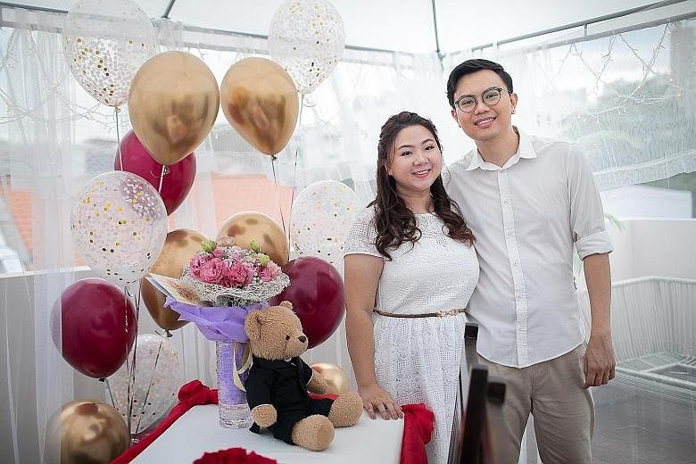 Public relations executive Joshua Yap and educator Melody Chew before their wedding on May 4. They had a much smaller ceremony than planned, but hope to throw a big banquet next year. 