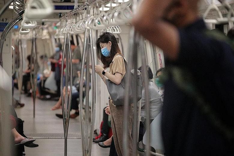 Commuters on the East-West Line at 7.50am on Wednesday. LTA said public transport ridership during the morning rush hour post-circuit breaker was at 36 per cent of the levels prior to the outbreak.