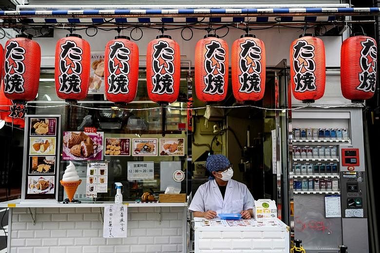 An ice cream shop in Tokyo last month. The latest data shows Japan's economy contracted 2.2 per cent in the last quarter, less than a 3.4 per cent drop in initial calculations. But the result was based on a survey that probably overstated the strengt