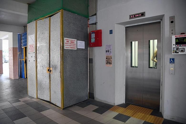 Lift upgrading taking place at an HDB block in Serangoon North last October. To date, contracts for the enhancement of 5,198 lifts in total within PAP town councils have been awarded, with a value of $107 million.