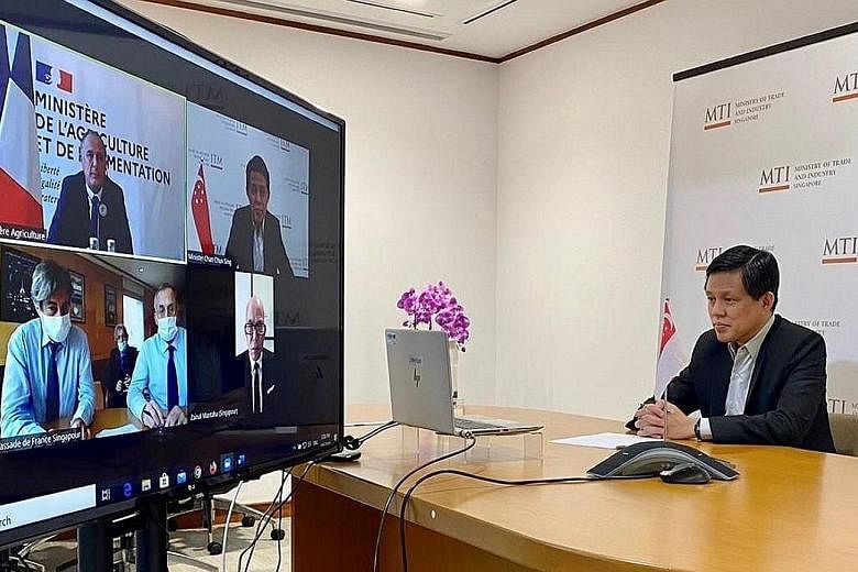 Trade and Industry Minister Chan Chun Sing in a videoconference with France's Minister of Agriculture and Food Didier Guillaume yesterday. They were joined by Singapore's Ambassador to France Zainal Mantaha and France's Ambassador to Singapore Marc A