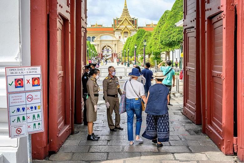 Visitors entering the Grand Palace in Bangkok on Sunday. Tourist attractions within 300km of Bangkok have welcomed 50 per cent to 70 per cent of their usual visitor numbers so far, said Tourism Council of Thailand president Chairat Trirattanajaraspor