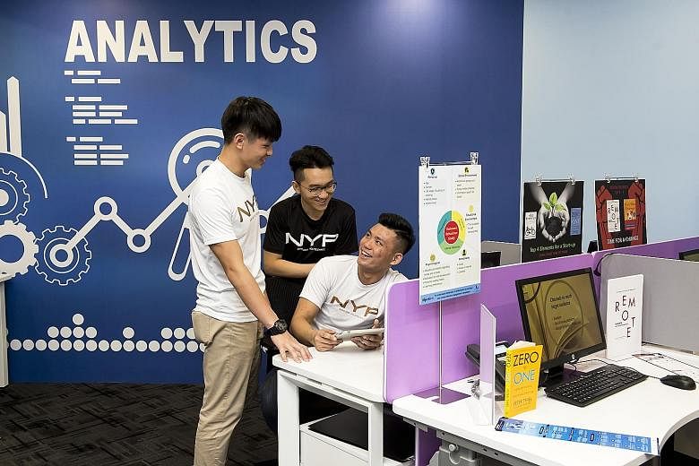 Nanyang Poly students working on a group project last year before the Covid-19 outbreak. Under the new approach, they will take on multi-disciplinary tasks or projects that combine several subjects and skills. PHOTO: NANYANG POLYTECHNIC