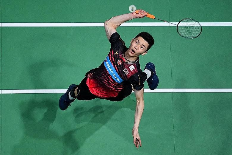 Malaysia's Lee Zii Jia leaping for a smash against Denmark's Viktor Axelsen during their All England Open semi-final in Birmingham in March. He lost 17-21, 21-13, 21-19 but he has been a rising star for Malaysia as the country seeks a first Olympic g