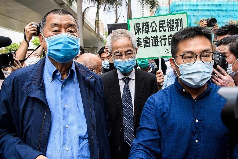 The Hong Kong High Court yesterday dismissed a legal challenge from League of Social Democrats chairman Raphael Wong (right) seeking to lift a ban on individuals who have served jail terms of three months or more from running for public office for fi