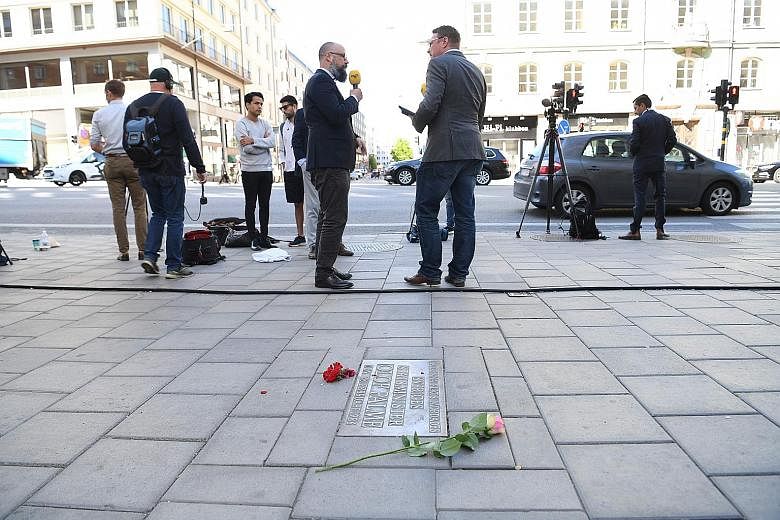 Suspect Stig Engstrom (above) died in 2000. Flowers next to a plaque in Stockholm yesterday, at the site where Sweden's prime minister Olof Palme was killed in 1986. PHOTOS: AGENCE FRANCE-PRESSE