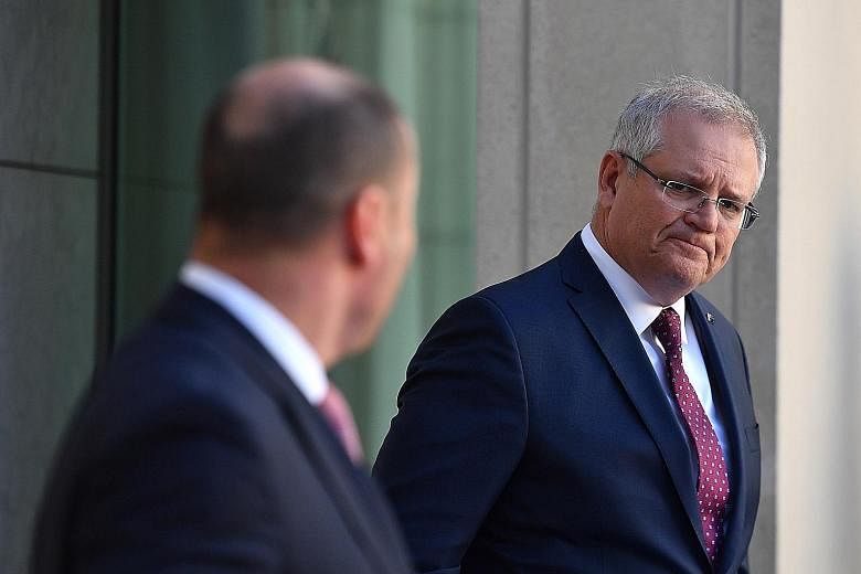 Australia will "never be intimidated by threats from wherever they come", Prime Minister Scott Morrison says.