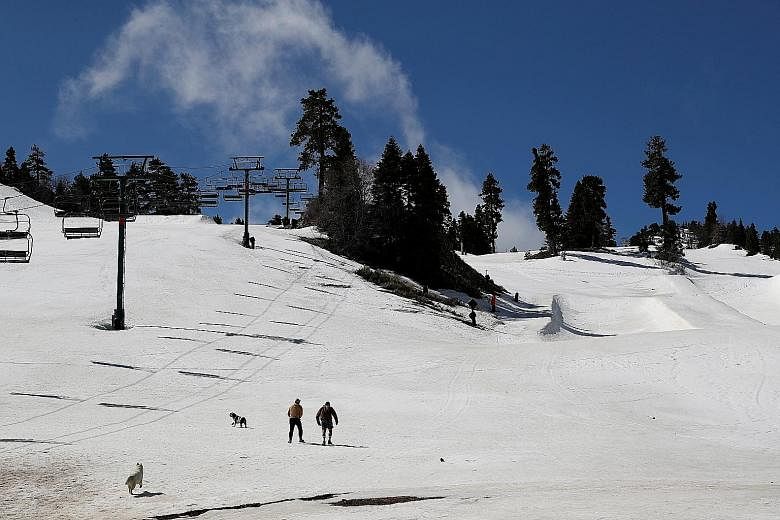 Vacationers at a ski resort area in California's Big Bear Lake in April, amid the Covid-19 pandemic. Pent-up demand over the past few months is leading to a rush of summer reservations on Airbnb, with traditional vacation rental markets such as Big B