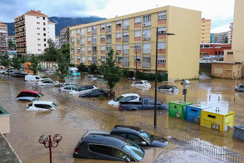 Partially submerged cars left in a flooded area after heavy rainfall in Ajaccio, on the French island of Corsica, on Thursday. Corsica is under orange alert due to severe weather. In just a few hours, nearly two months' worth of rain deluged portions